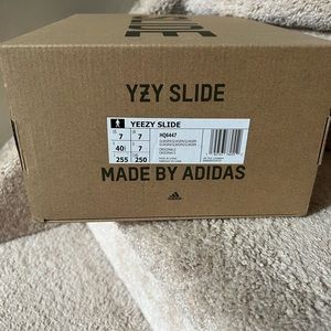 Selling brand new with tag Yeezy Slides in color Green Glow